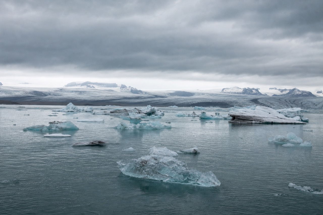 Wide view of Jokulsarlon glacier lagoon with floating icebergs and the Breidamerkurjokull glacier tongue behind